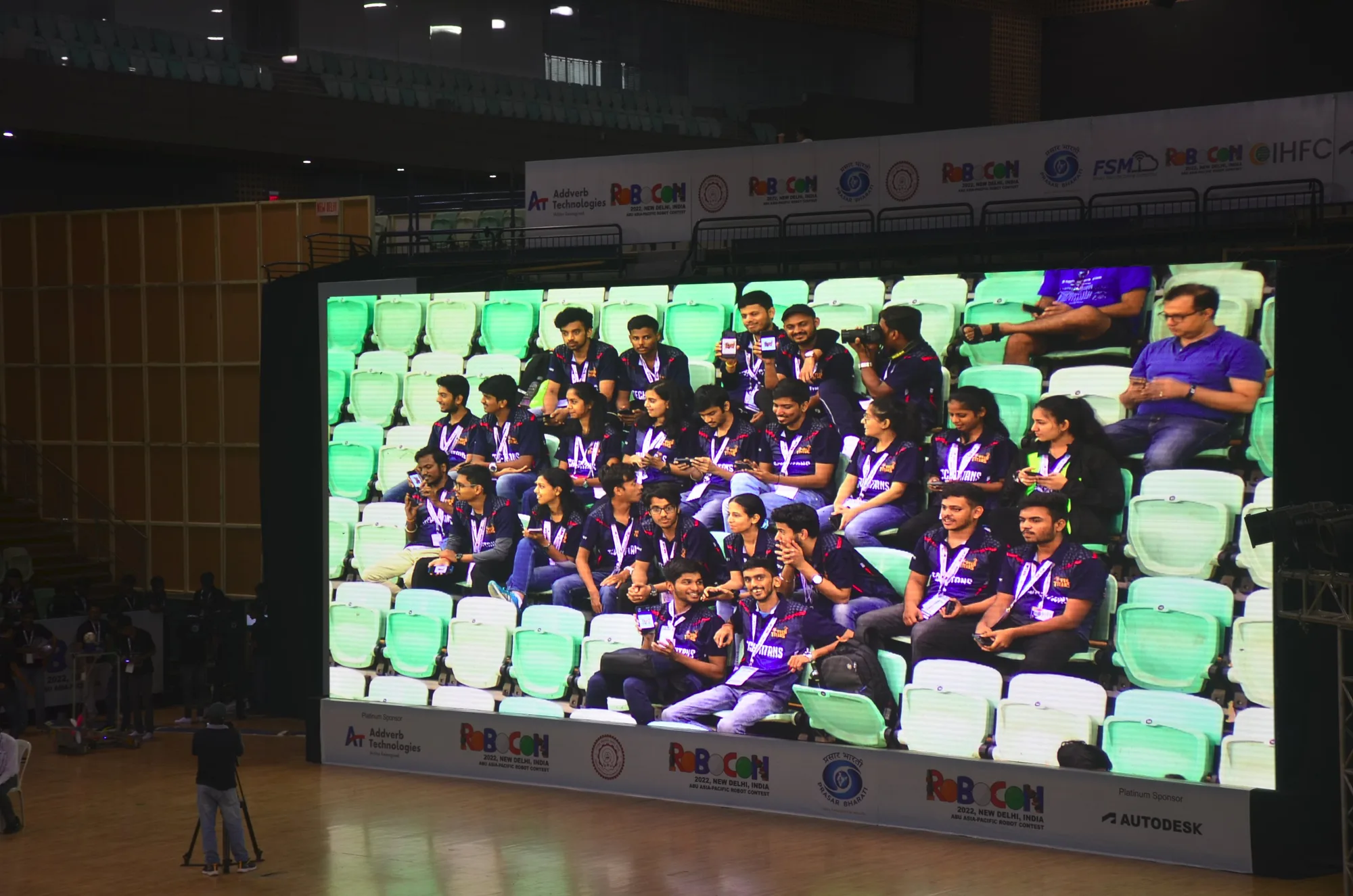 The Tech Titans team shown on the large arena screen in the stands at DD Robocon 2022.